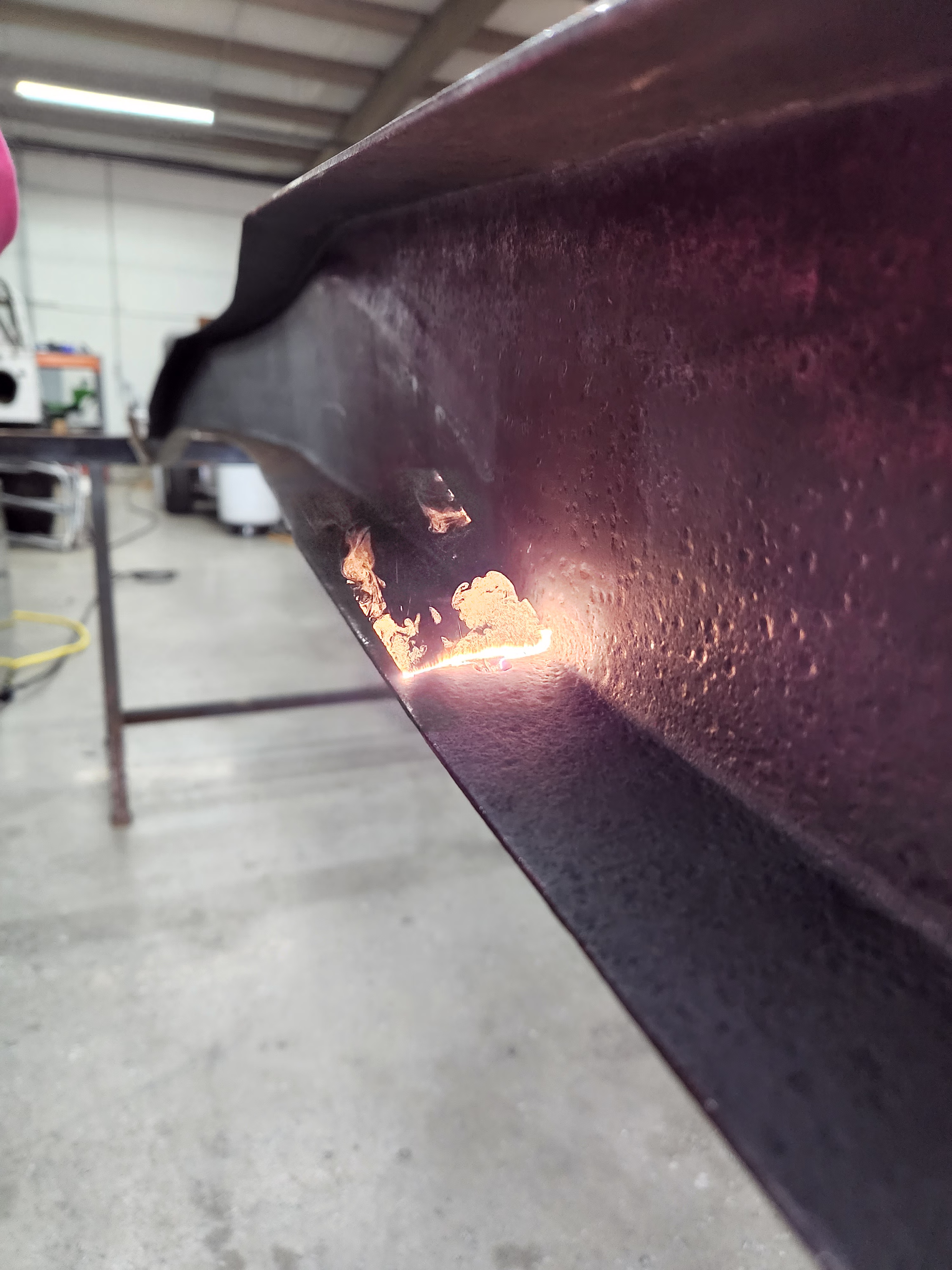 Lower framerail laser rust removal.
